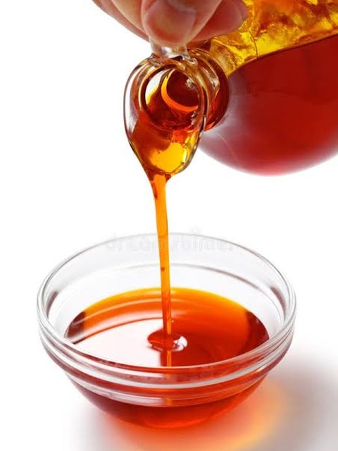 A jar of golden palm oil after Femto treatment